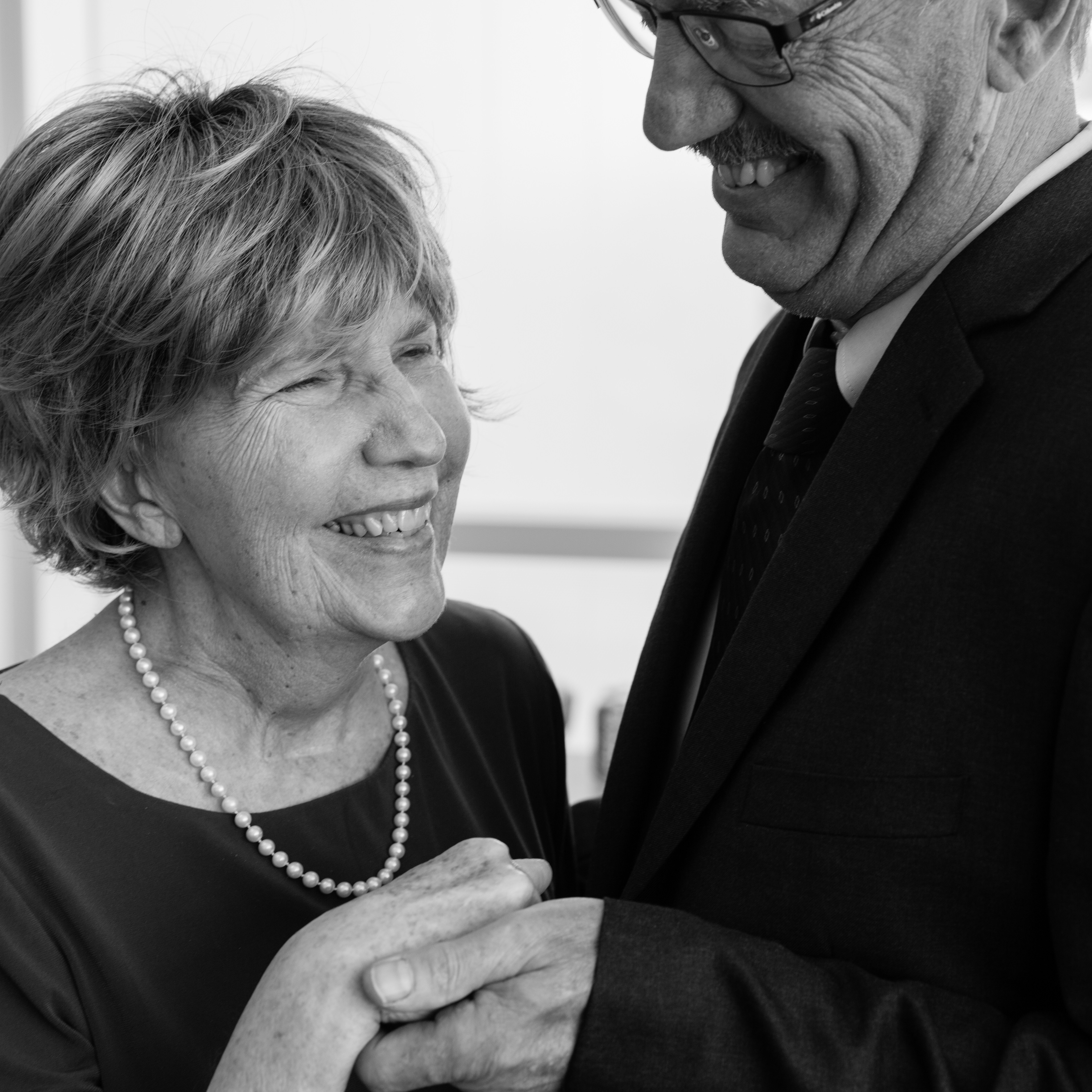 An older married couple standing together