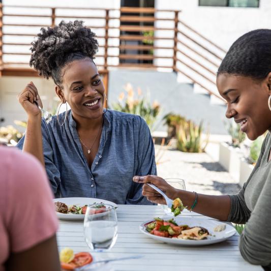Women around table eating lunch