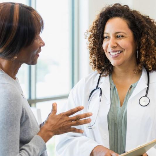 woman speaking with doctor
