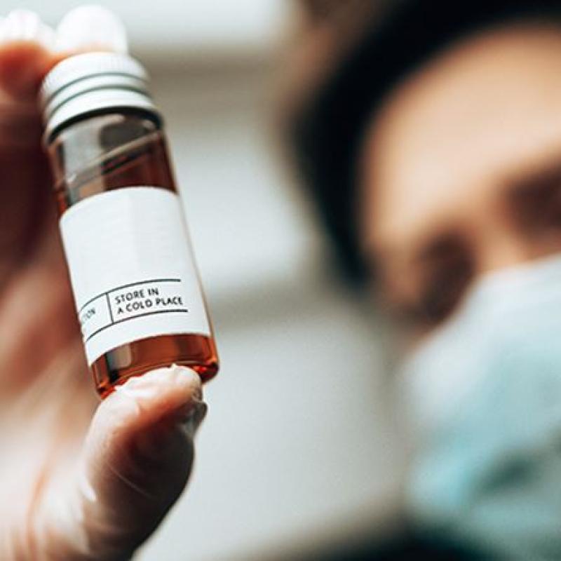 Woman reading medicine tube