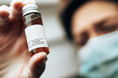 Woman reading medicine tube