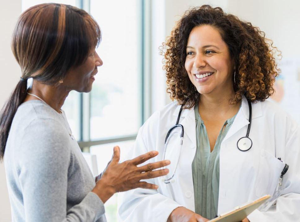 woman speaking with doctor