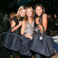 Group posing together with their handbags