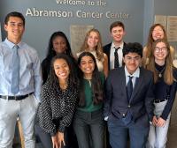 interns post in front of the Basser Center